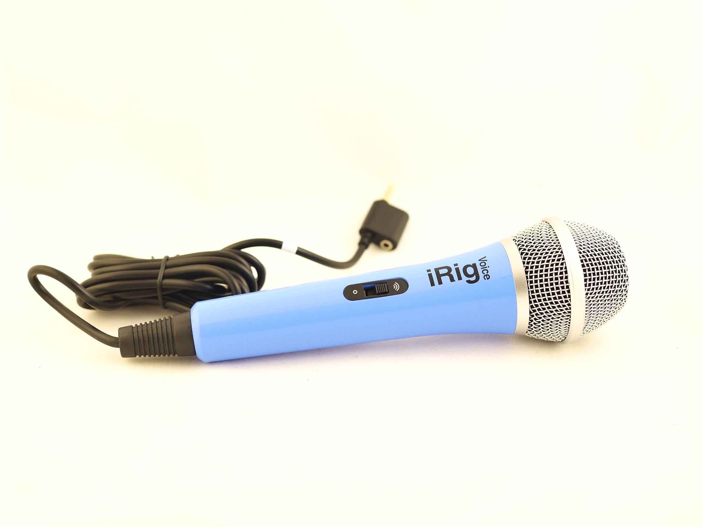 Blue microphone lying on a white surface